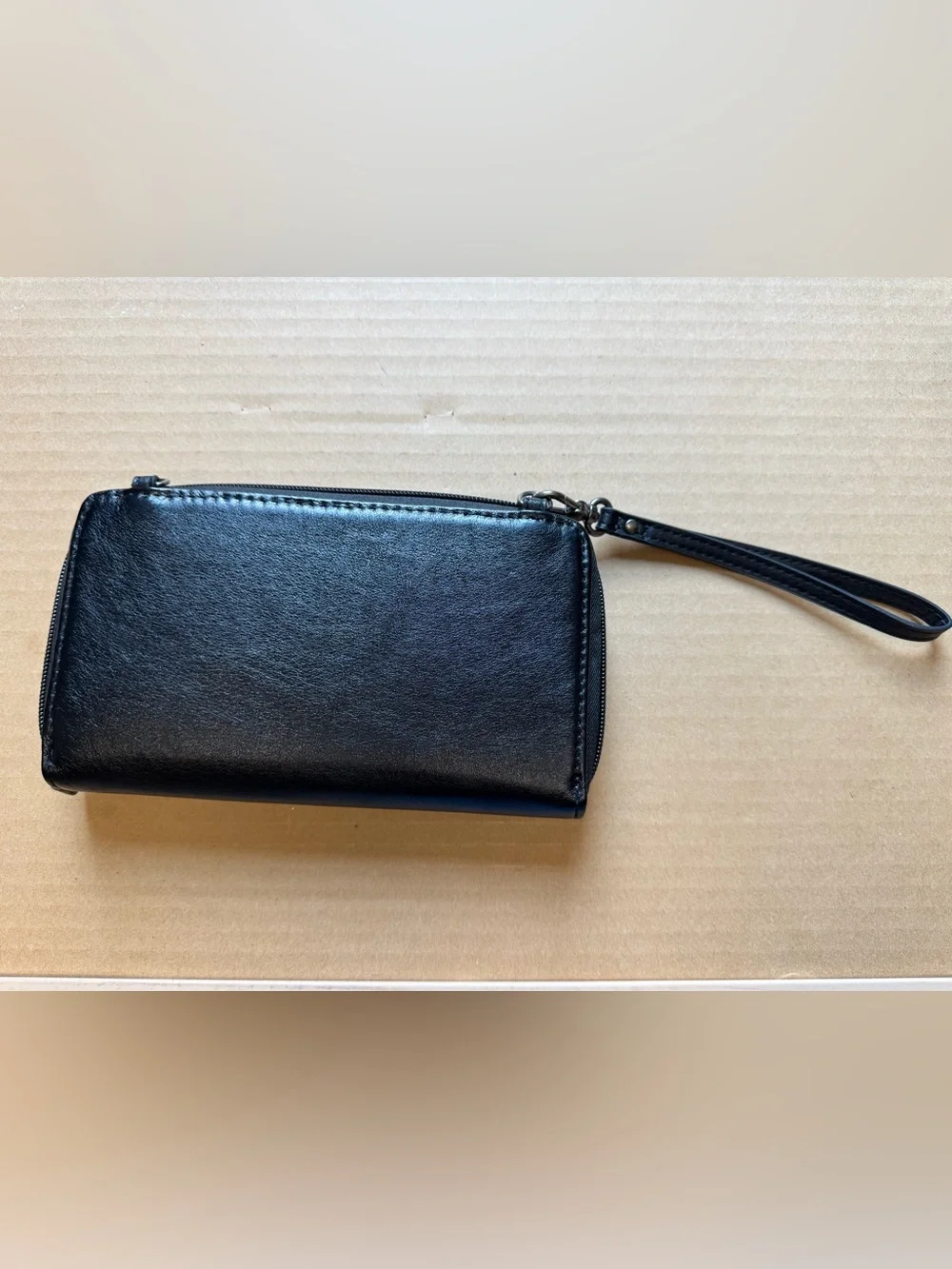 The Sak Black Leather Wristlet Clutch with Snap Strap